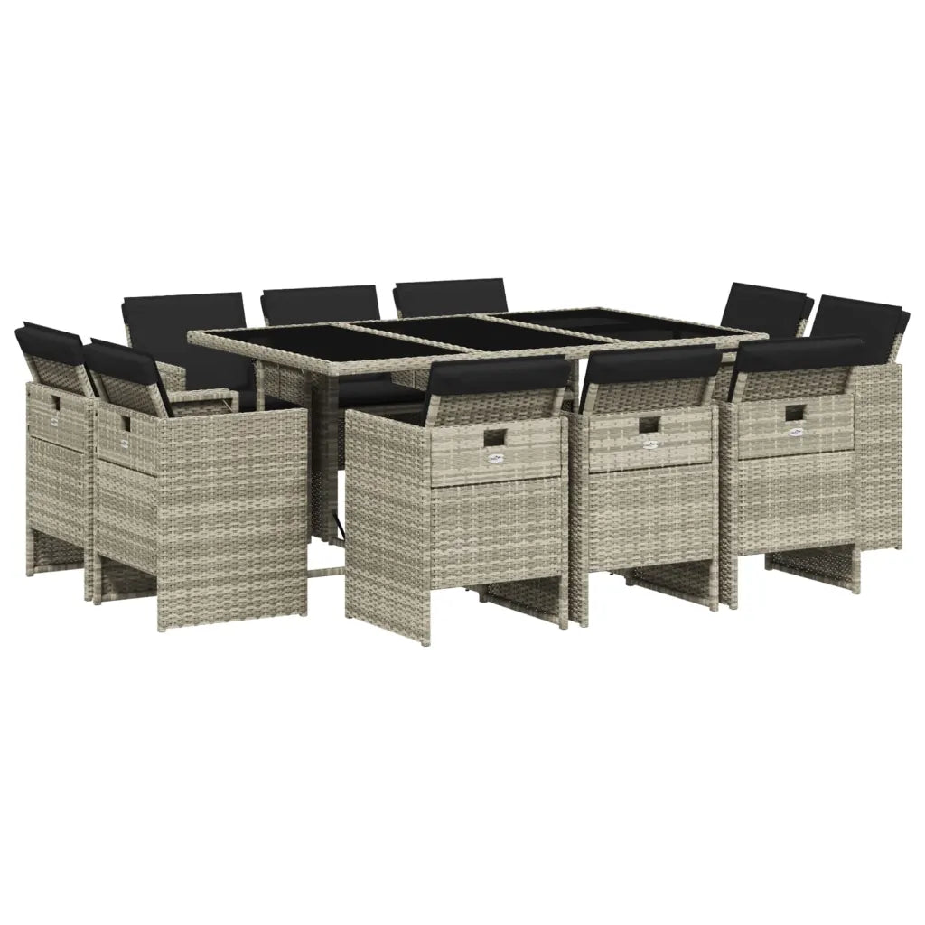 Salon de jardin ultra compact en rotin gris clair avec table en verre.