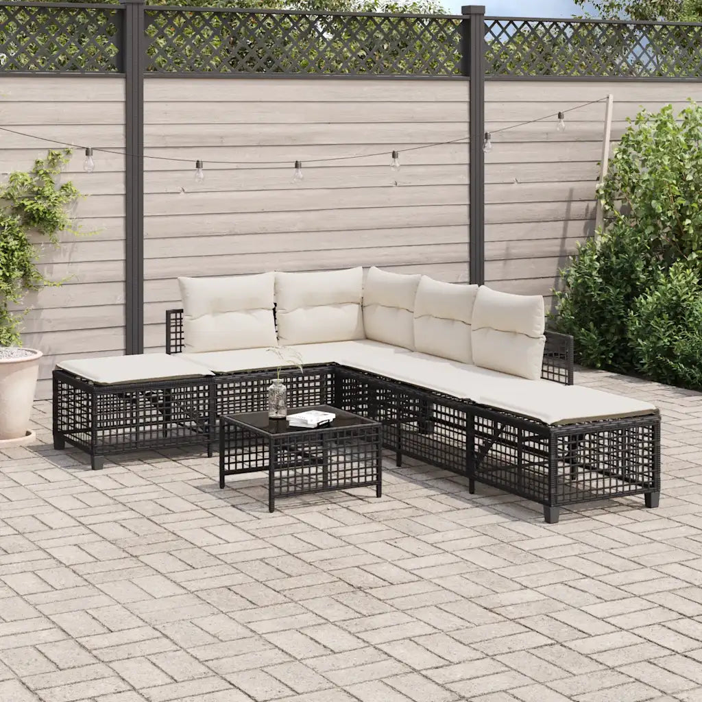 Salon de jardin d’angle noir avec coussins blancs sur terrasse moderne.