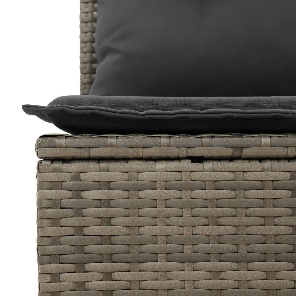 Détail du tissage en rotin PE et des coussins gris foncé avec housses amovibles