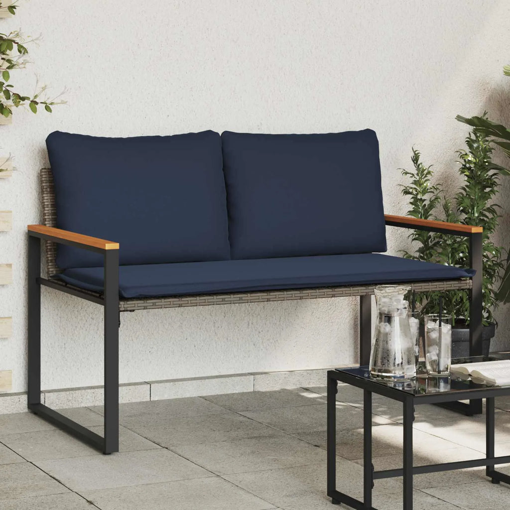 Banquette de jardin en rotin avec coussins bleu marine, design élégant pour terrasse moderne
