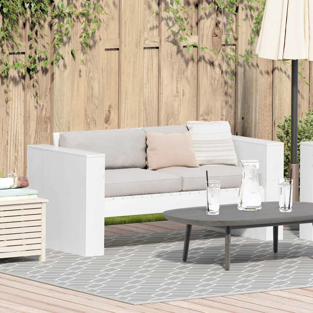 Vue latérale du canapé de jardin en bois massif blanc, finition lisse et élégante

