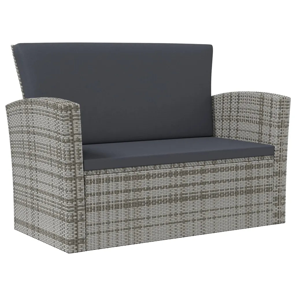 Fauteuil salon Acapulco vue de face avec coussin gris foncé et structure rotin PE