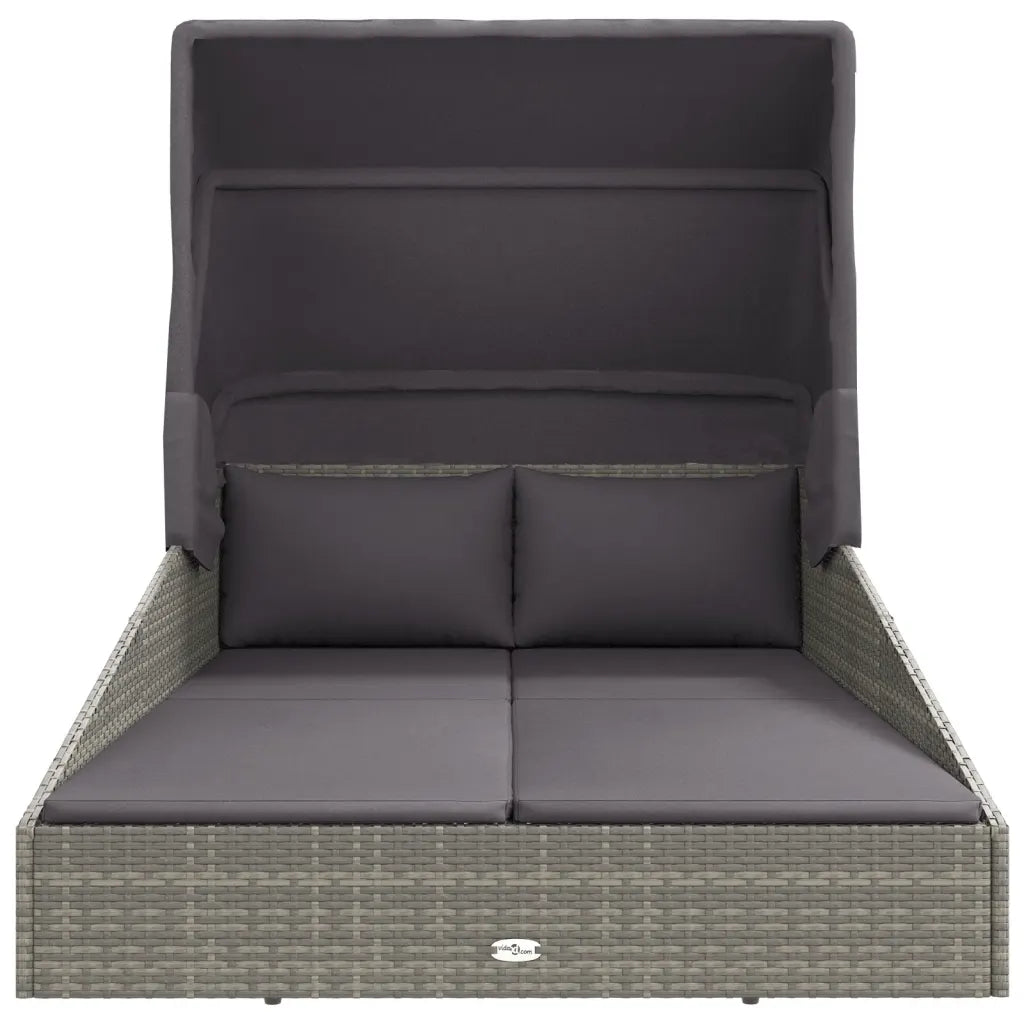 Canapé lit de jardin gris clair avec coussins moelleux et oreillers
