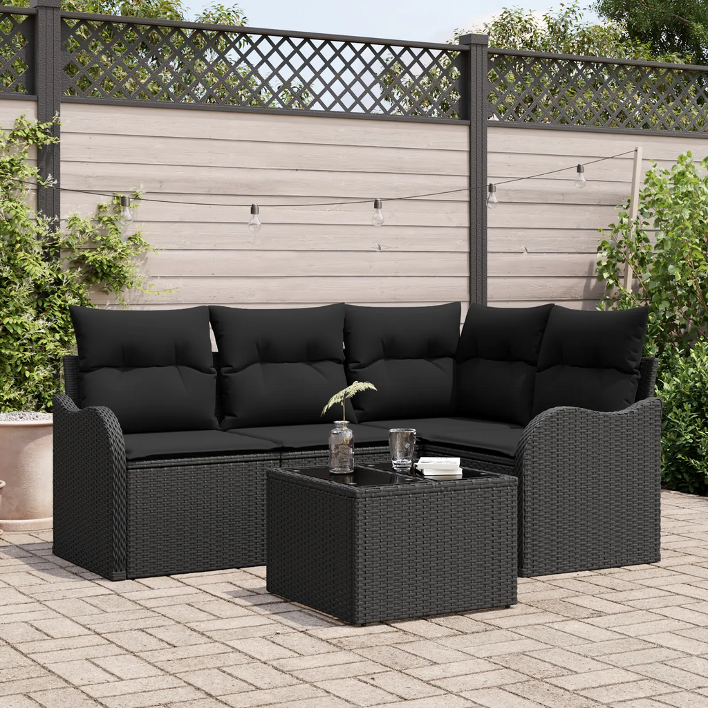 Salon modulable en résine tressée noire sur terrasse.